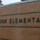 This handout crime-scene evidence photo, provided by the Connecticut State Police, shows the exterior of the Sandy Hook Elementary School in Newtown, Conn., on an unspecified date after the Dec. 14, 2012, shooting rampage.
Handout/Getty Images